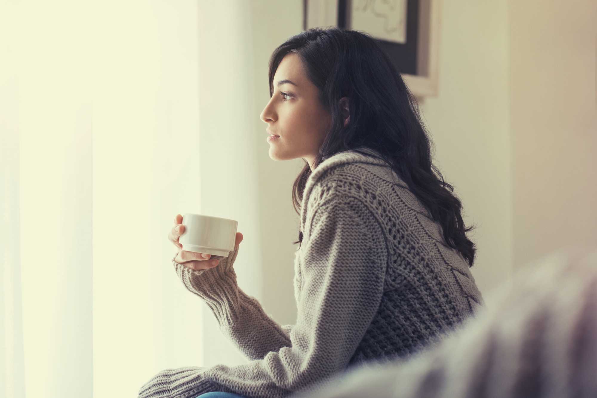 Lady thinking with a drink image from Canva